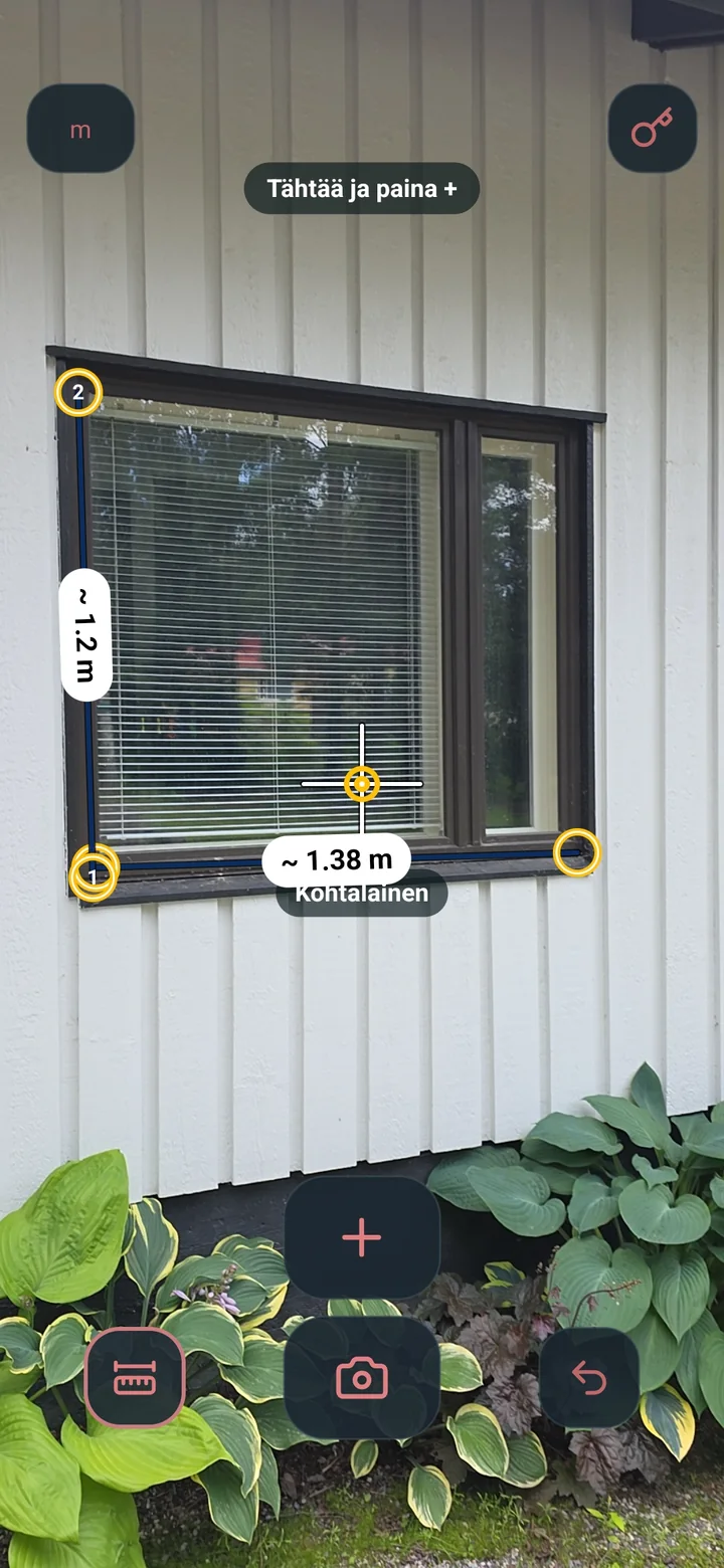 Pikku Mitta AR camera view measuring the width and height of a window with anchored points and visible results.